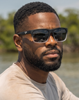 Man, 31, wearing Peppers Grand Teton sunglasses in Matte Crystal Clear to Black Frame with Smoke Lens, on the flats
