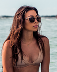 Lifestyle photo of Spitfire sunglasses milky caramel tortoise temple with brown polarized silver flash mirror lens
