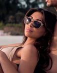 Lifestyle photo of Spitfire sunglasses milky caramel tortoise temple with brown polarized silver flash mirror lens