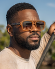 Man, 31, wearing Peppers Cascade sunglasses in Caramel Frame / Tort Temples with Brown Lens, on the flats