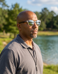 Man, 38, wearing Peppers Mermaid sunglasses in Shiny Crystal Frame / Tort Temples with Silver Mirror Lens, at a lakeside park