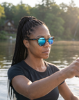 Woman, 37, wearing Peppers Mermaid sunglasses in Shiny Honey Tort Frame with Blue Diamond Mirror Lens, on a calm lake